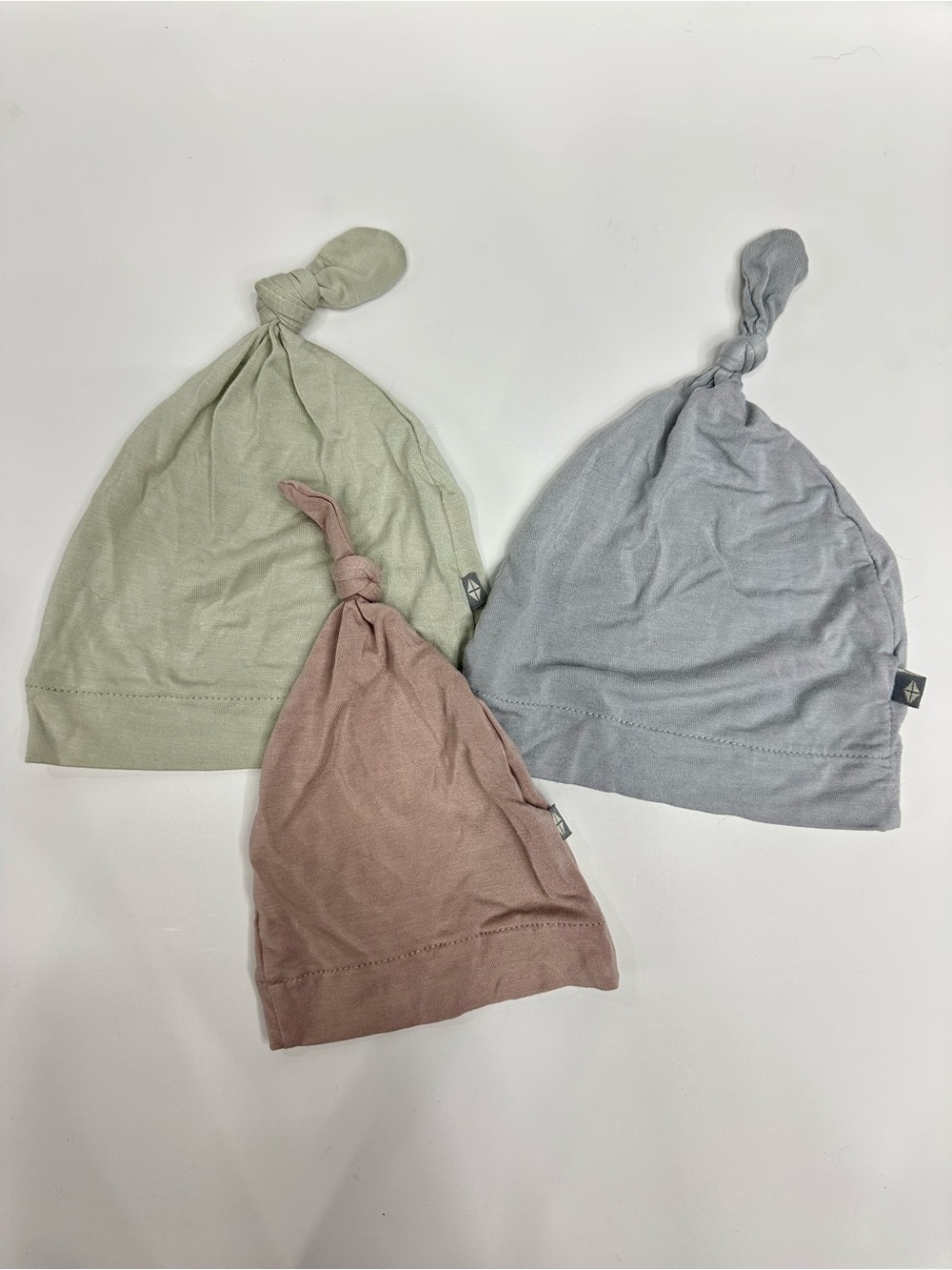 Kyte BABY Knot Hats in Sage, Dusty Rose, and Light Gray